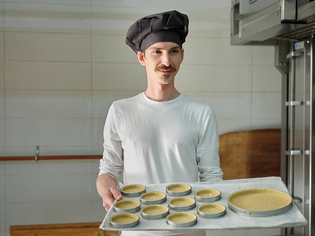 Portrait of a baker with molded pastries