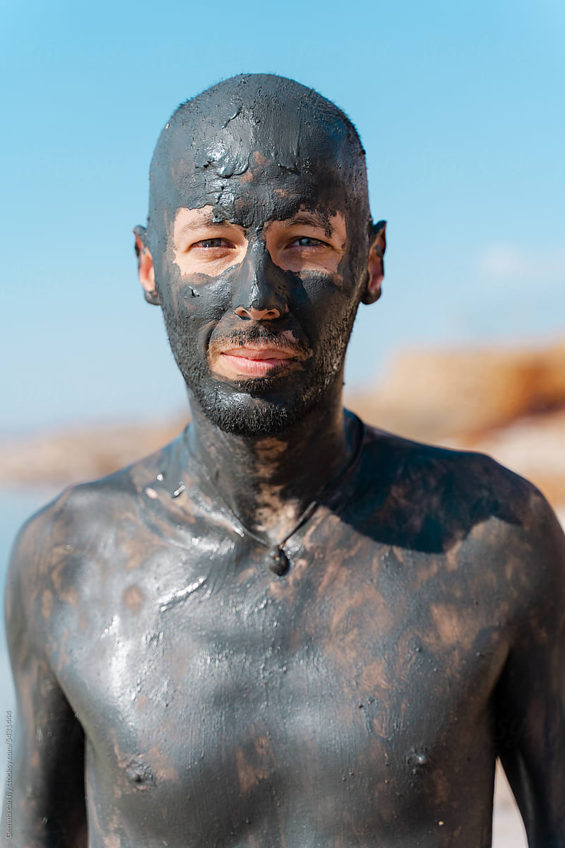 Man with Mud Mask at Lakeside