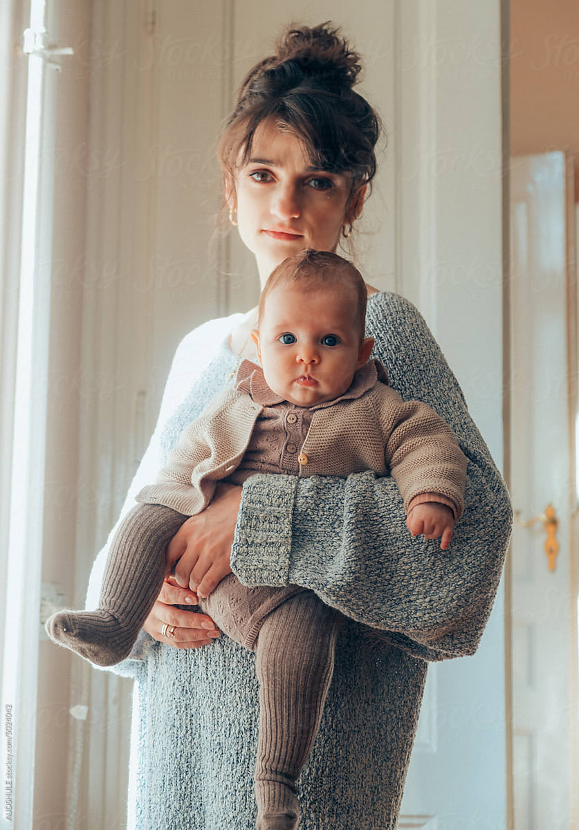 Beautiful mother and baby in knitwear.
