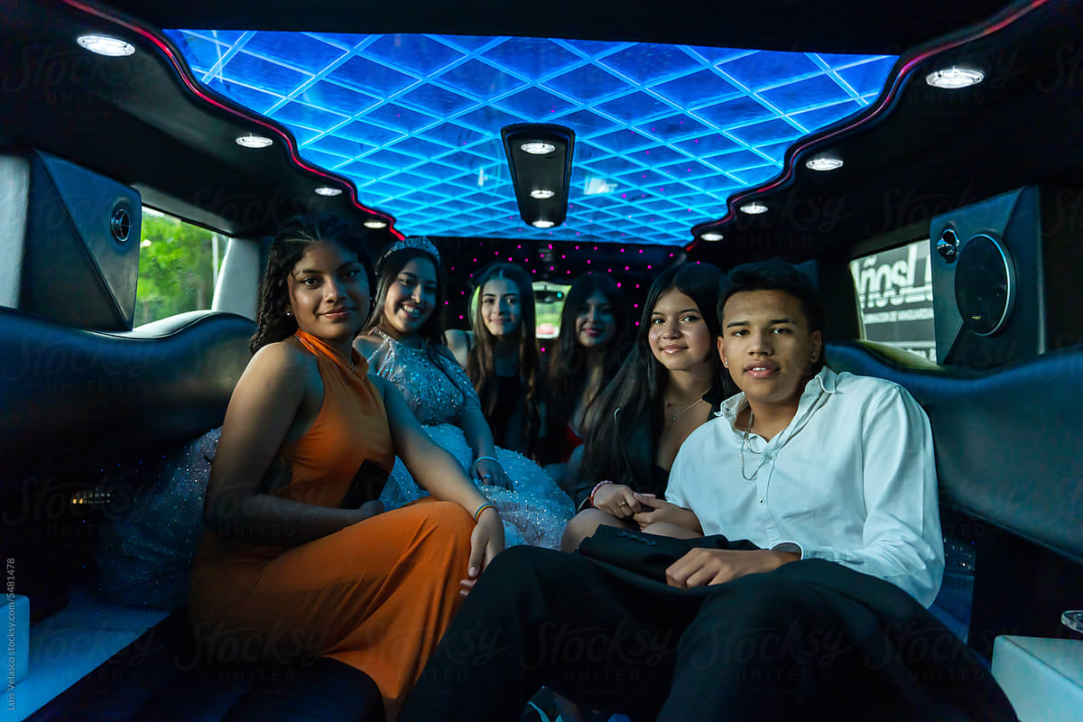 Portrait Quinceanera With Friends On Her Birthday In A Limousine.