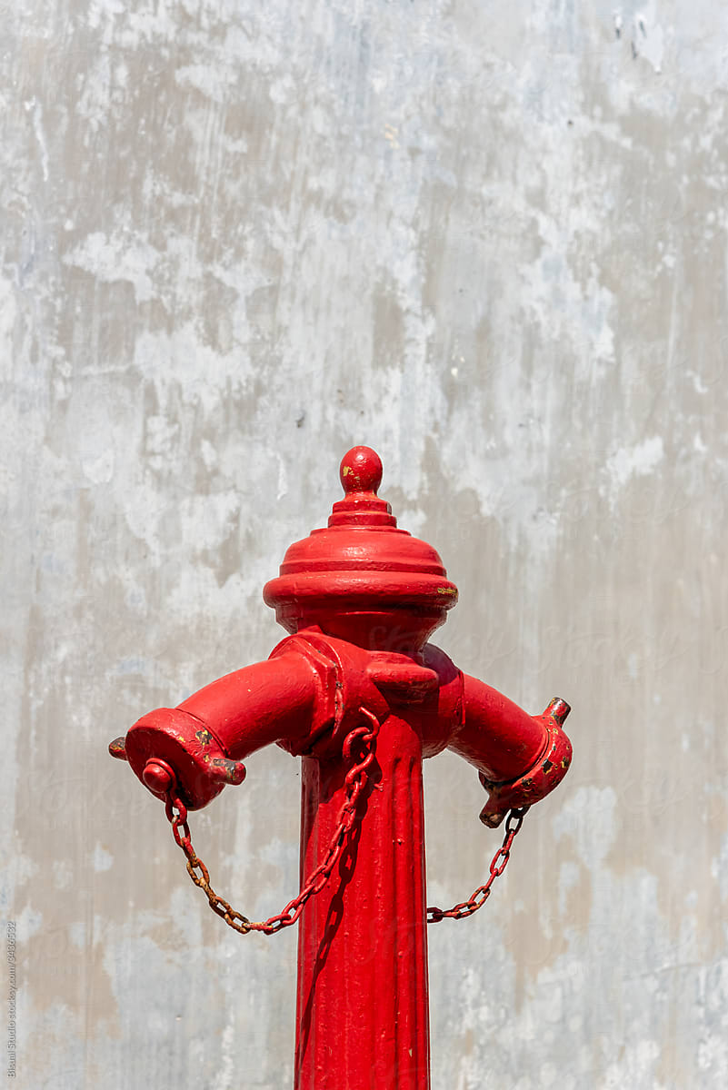Fire hydrant isolated over a gray textured background