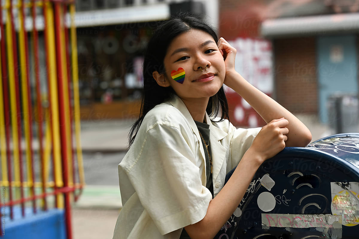 Young woman with rainbow for pride