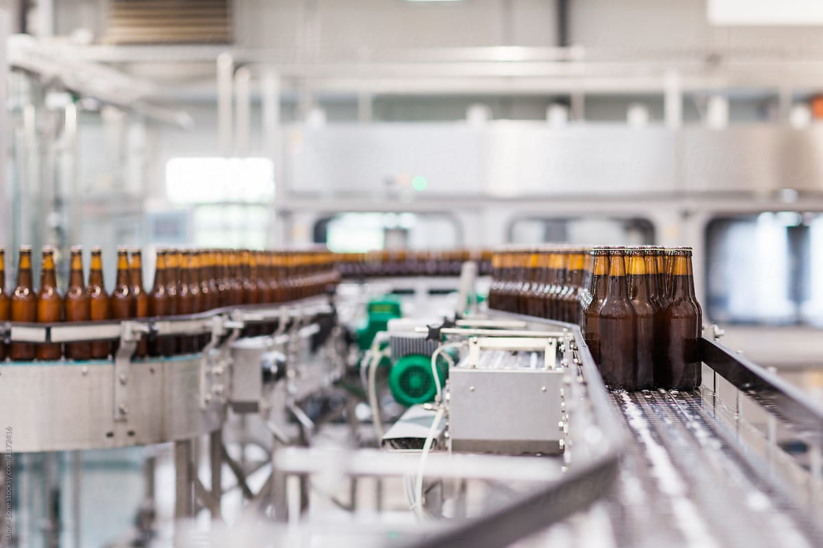 Beer bottles on an industrial factory conveyor