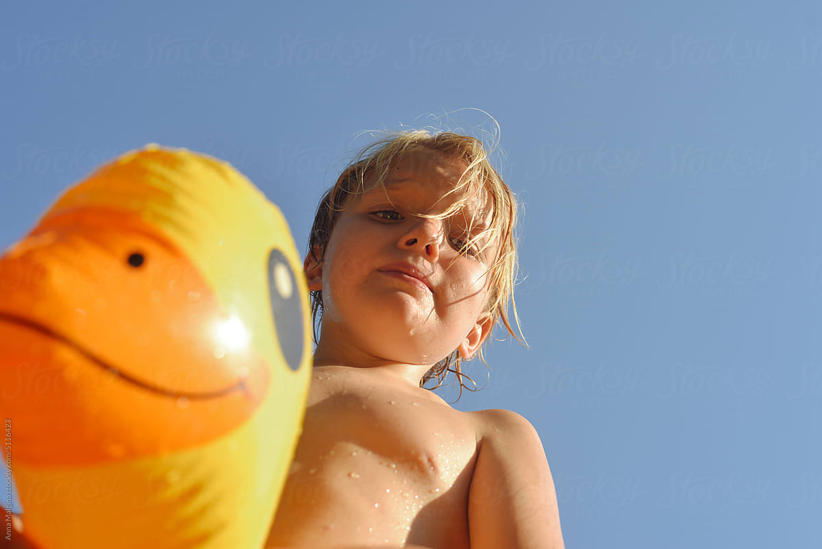 A kid with ribbon yellow duck