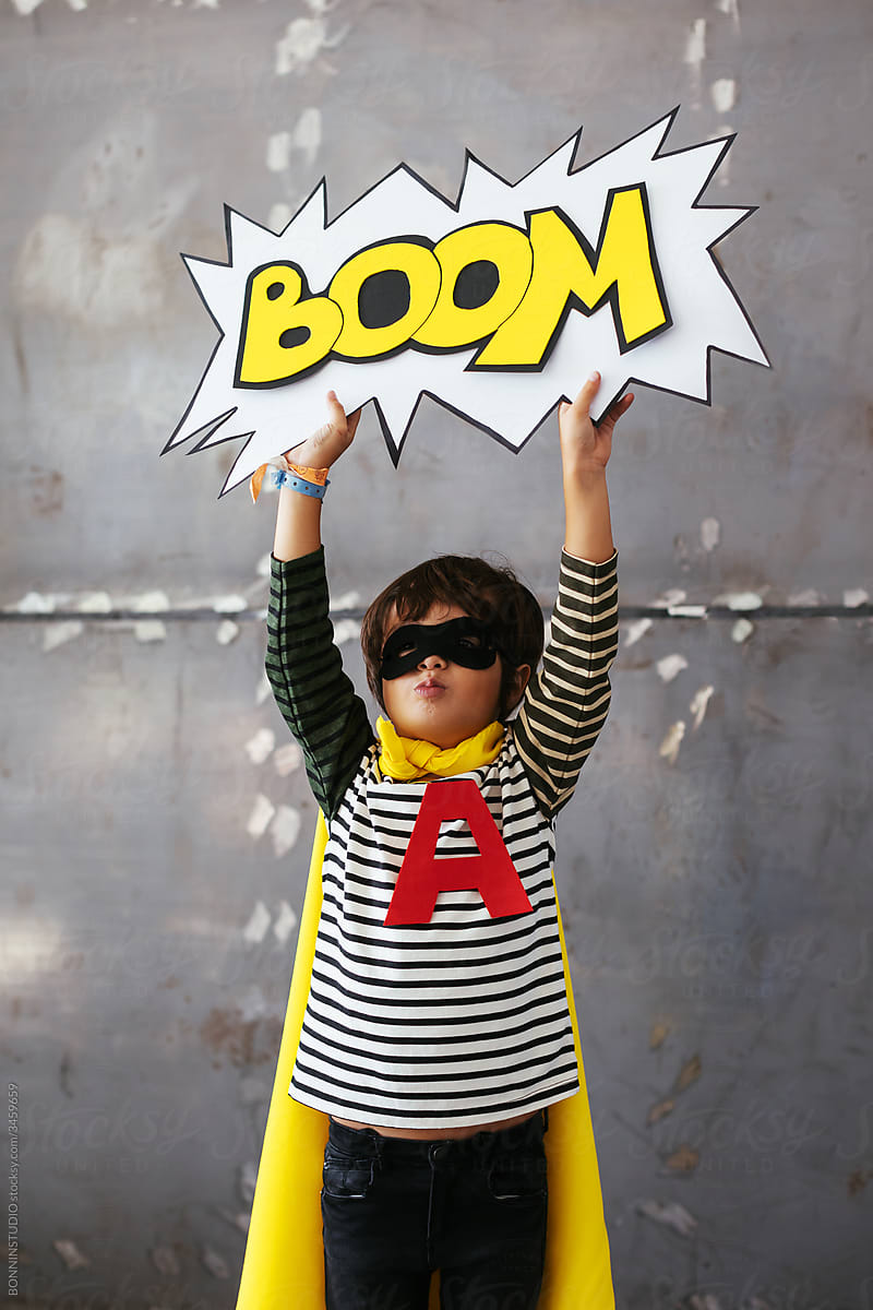 Cute superhero with Boom speech bubble over head
