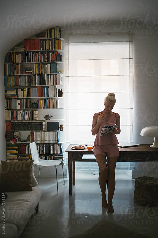 Woman Wearing Lingerie Reading A Magazine By Lumina Stocksy United
