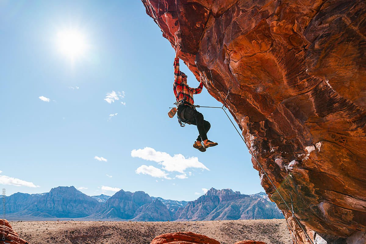 Rock climber lead climbing