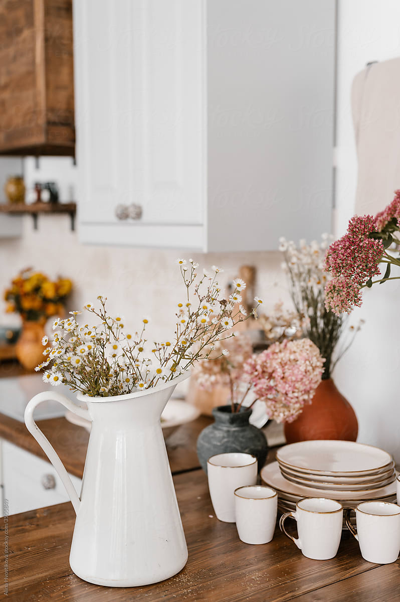 Flowers and dishware in kitchen