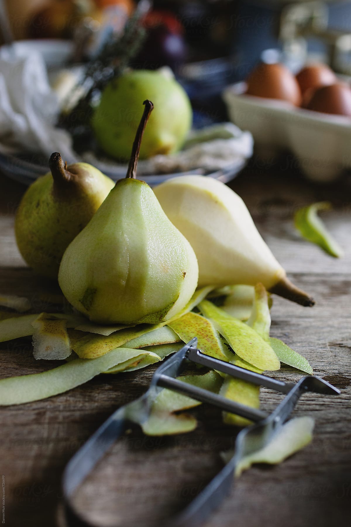 Peeling pears for use in a dessert.