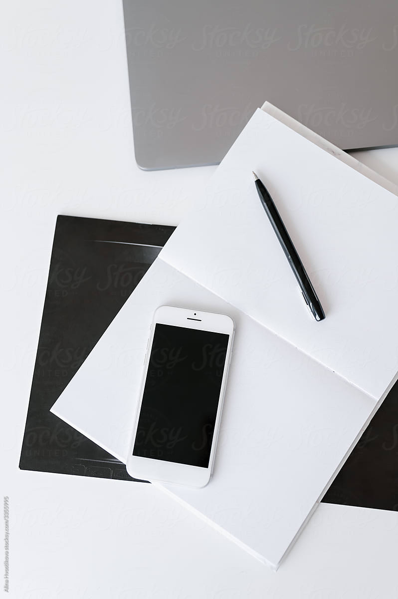 Smartphone and stationery on desk