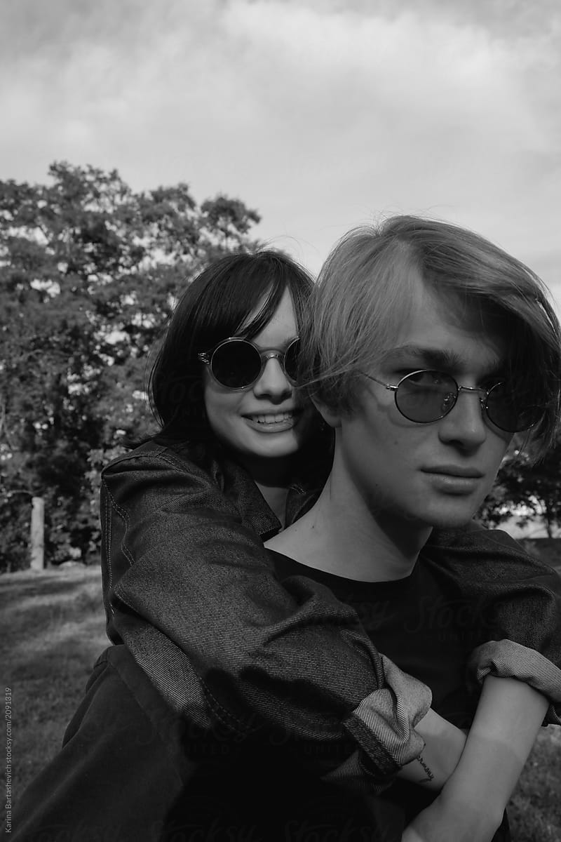 black and white portrait of a stylish couple in sunglasses