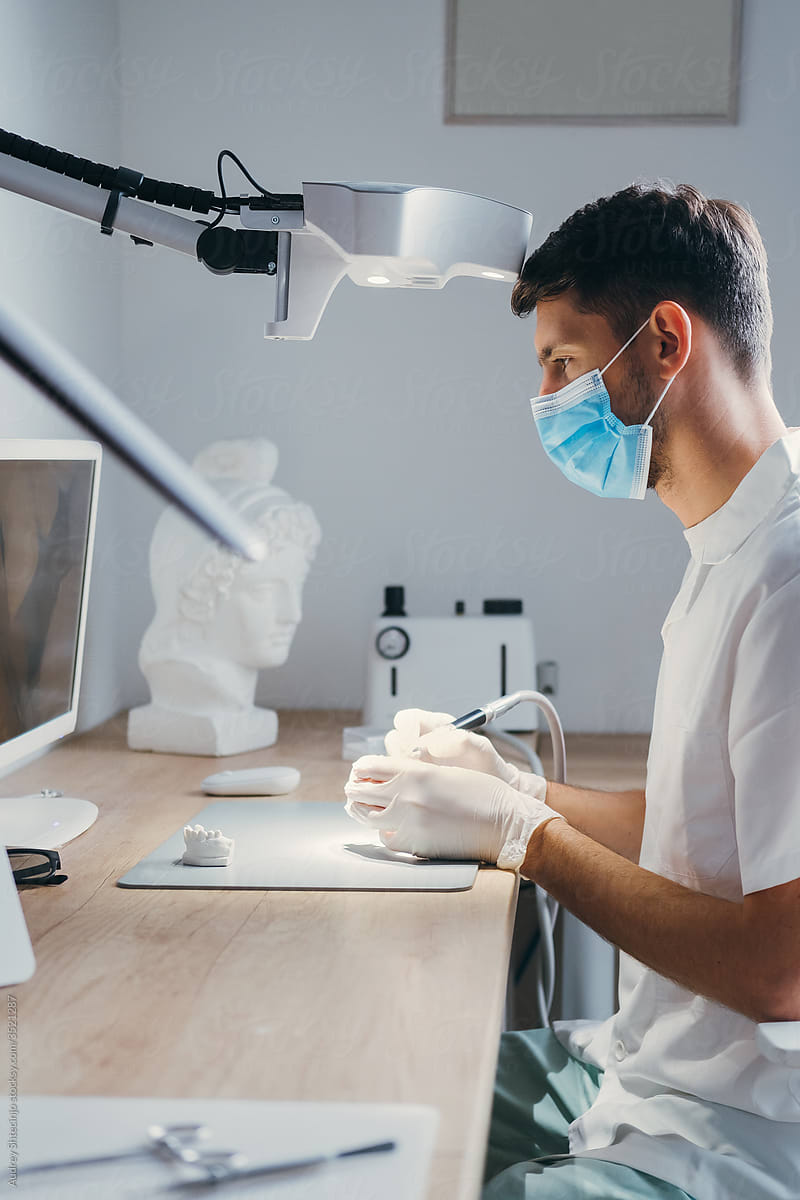 Dental Technician Making New Dental Prosthetics in Laboratory.