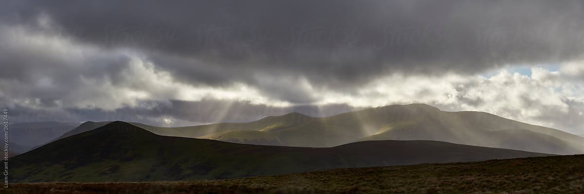 Rain and sunlight over Skiddaw. Lake District, Cumbria, UK.