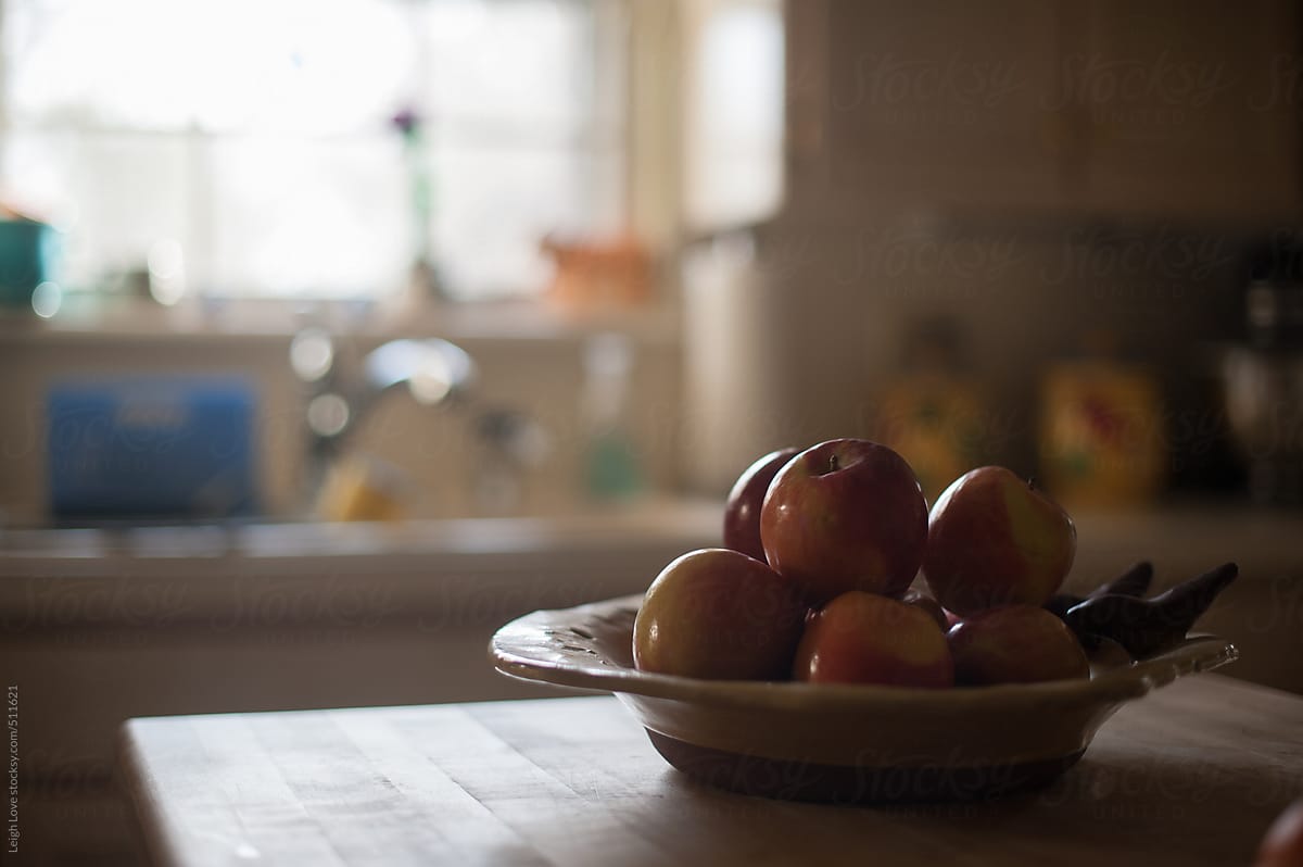 Bowl of Apples on Butcher Block Island in Kitchen