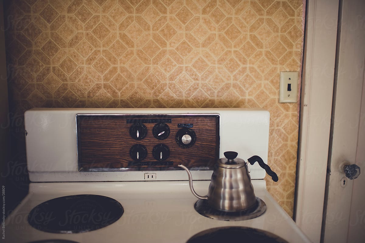 Vintage stove and kettle in old apartment