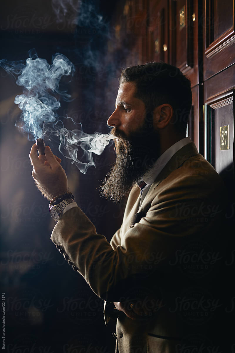 Man holding cuban cigar.