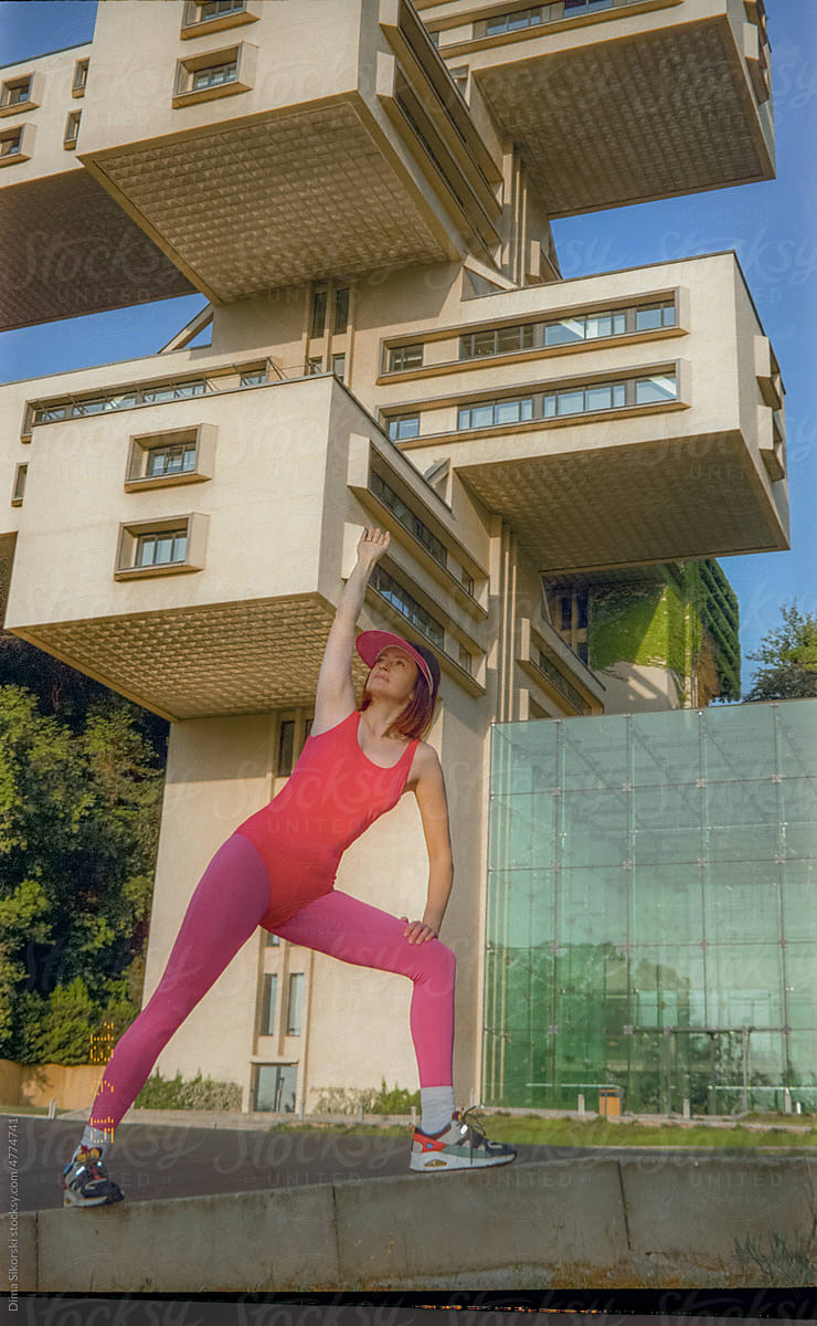 a girl in sportswear of the 80s does aerobics outdoors