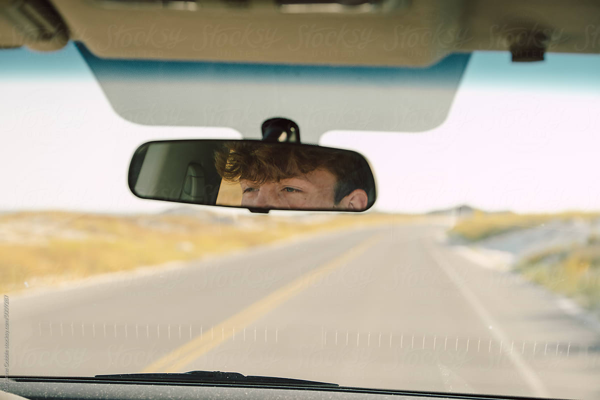 Teen Boy Driving a Car