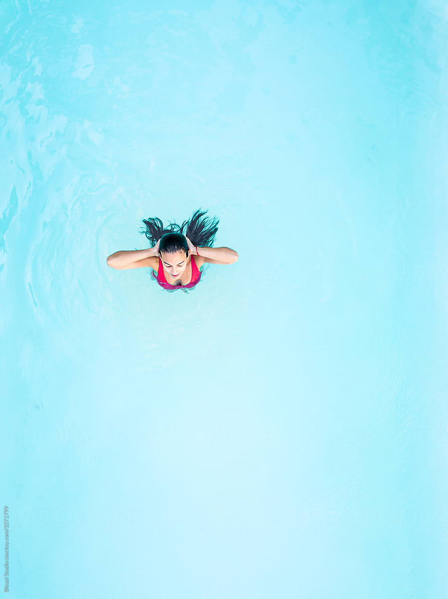 Aerial view of a woman in the pool