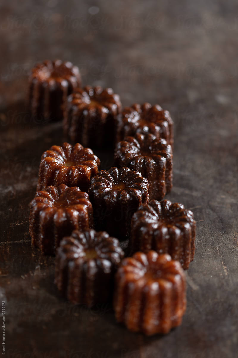 Canelé - French pastry on a grey plate