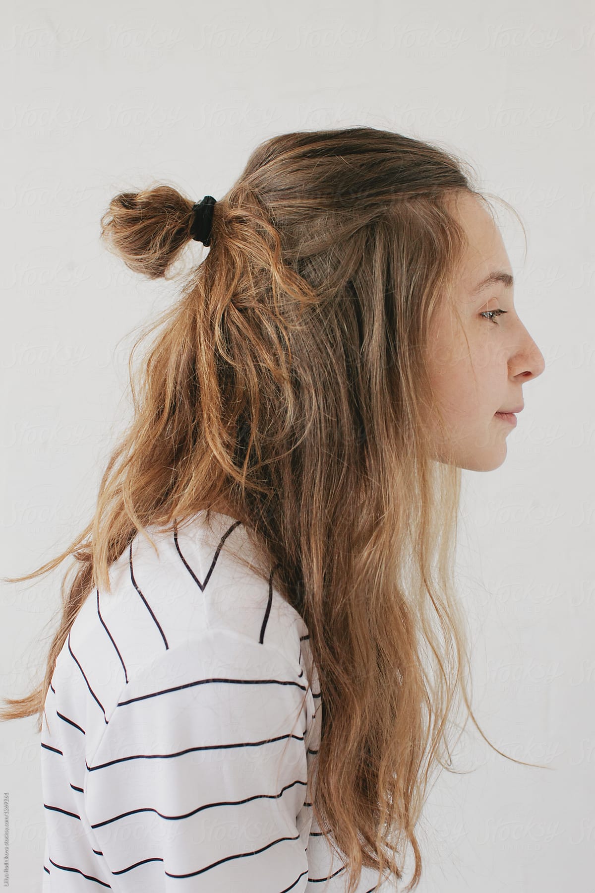 Young woman with long hair in profile