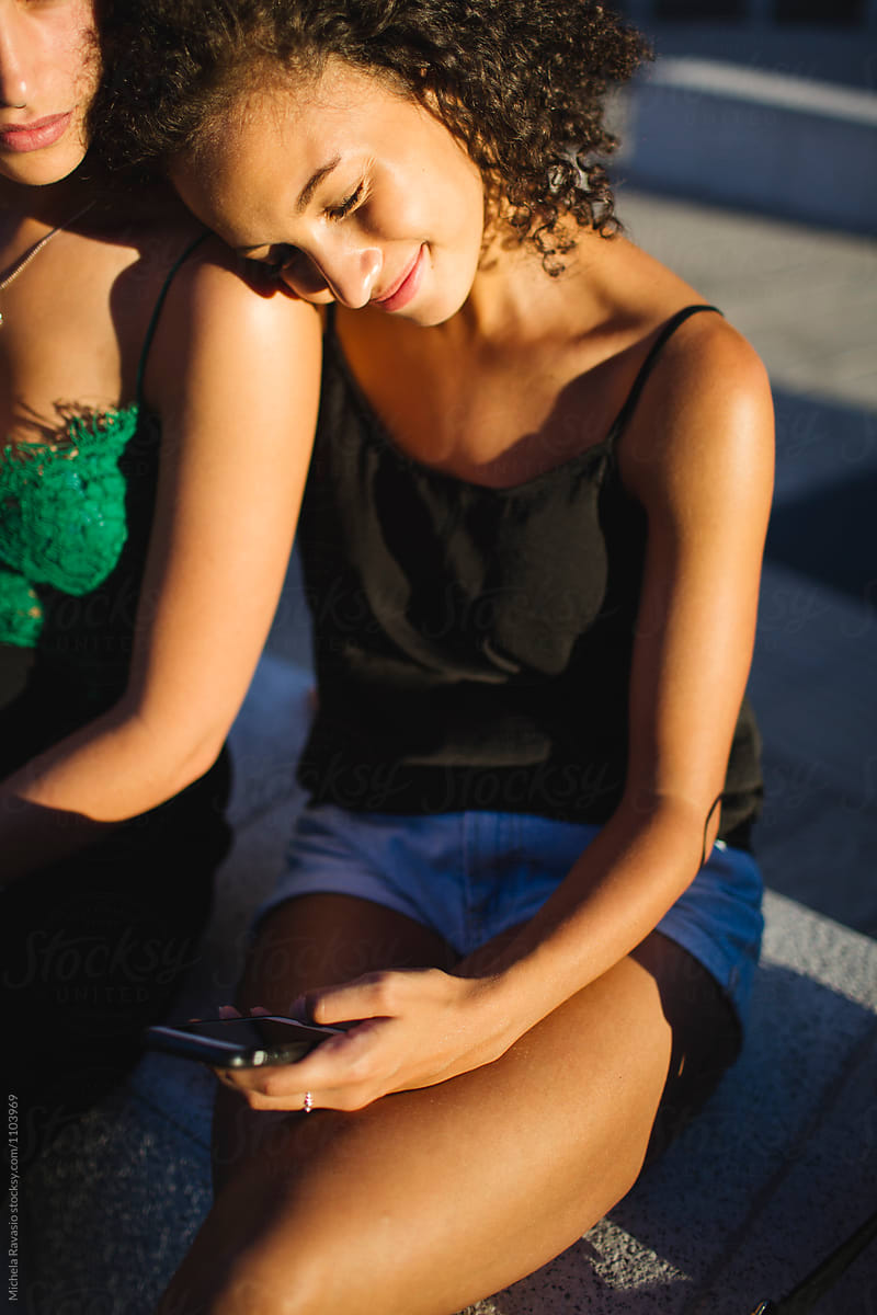 Relaxed Woman Using Her Cell Phone By Stocksy Contributor Michela Ravasio Stocksy