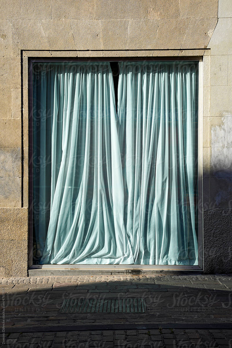 A showcase with curtains.