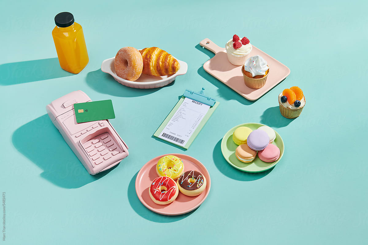 Set of bakery served on the table with bill, credit card and POS