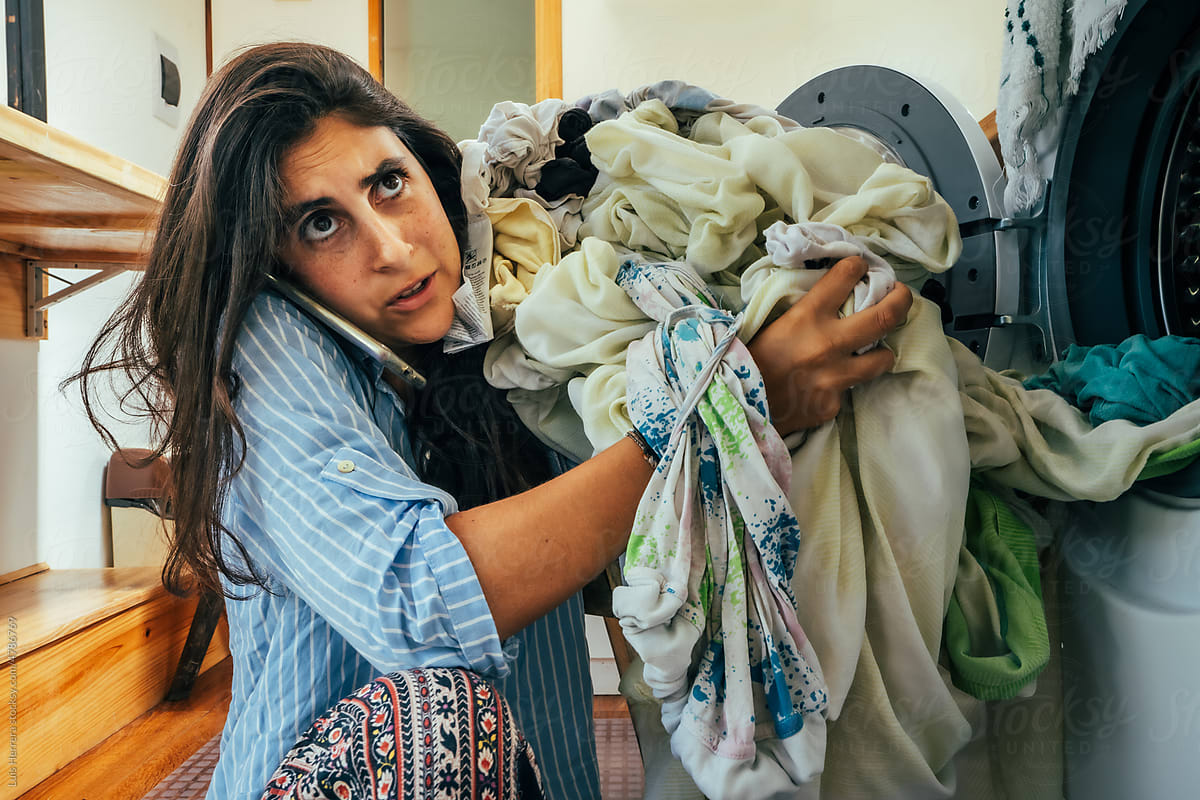 Overwhelmed Woman Doing Laundry