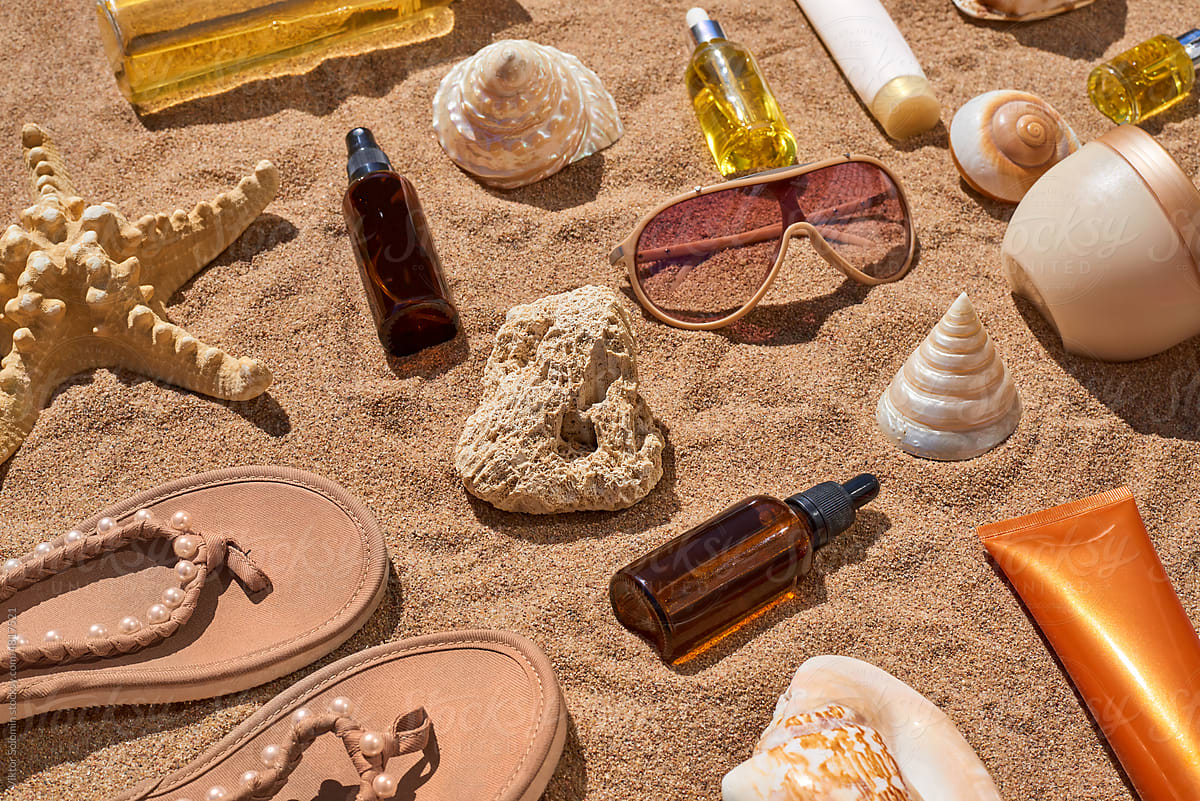 Bottle and seashells on sand