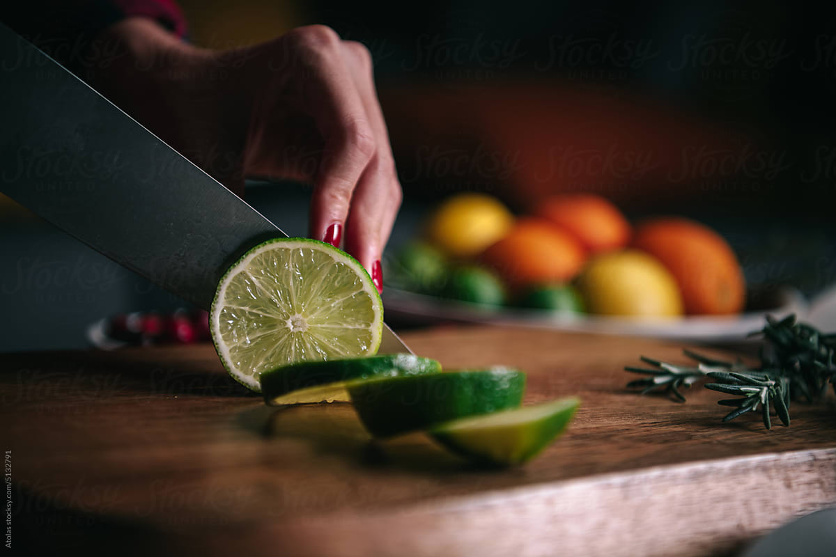 Cutting Lime on wooden board