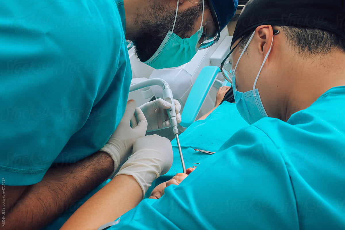 Putting implants during surgery in dental clinic