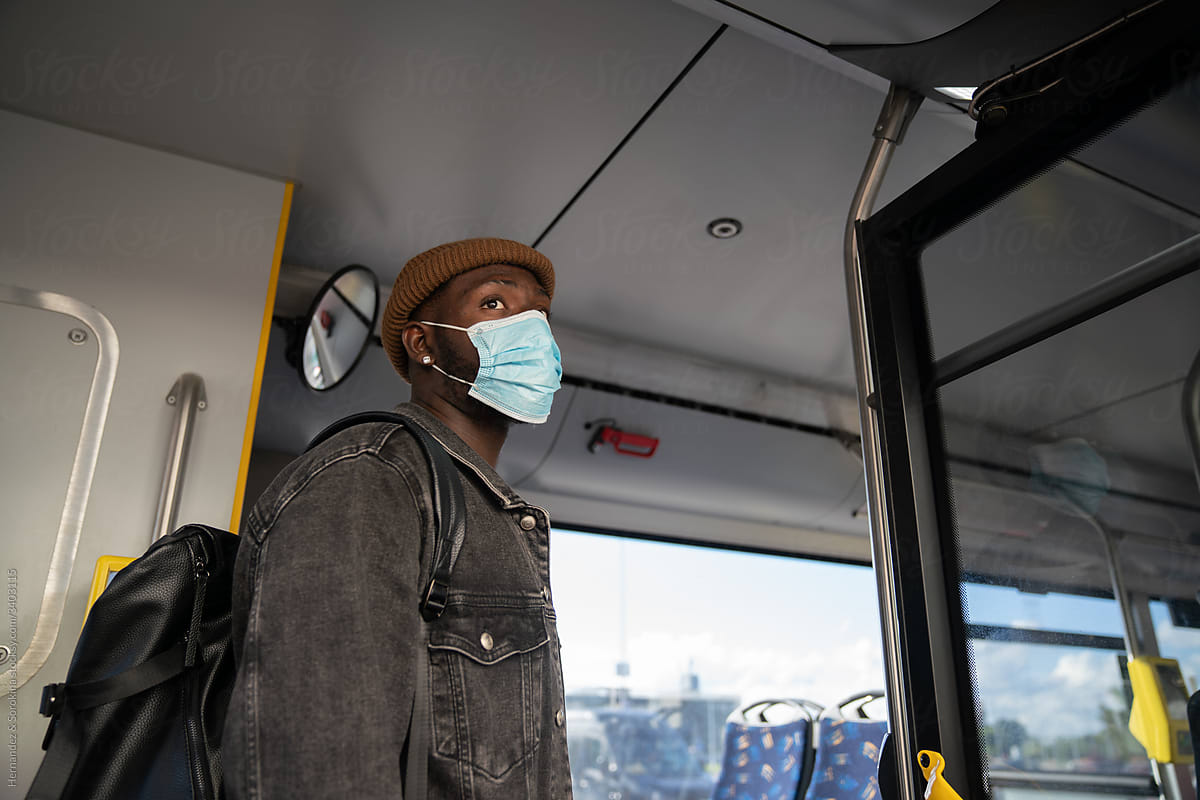Man Traveling in Public Transport With Surgical Mask