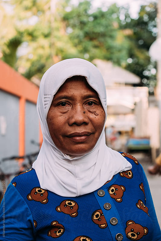 Indonesian old woman runs a bike rent business on Gili islands