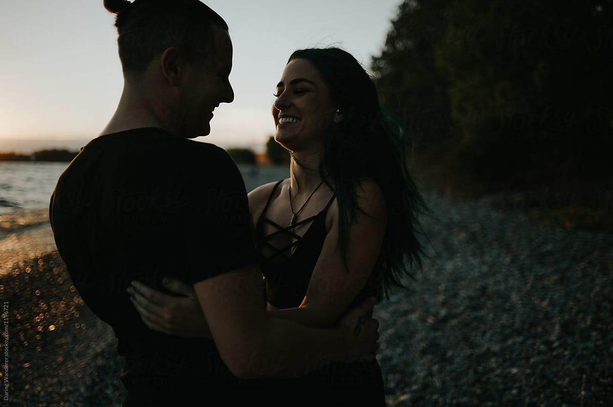 Happy Young Lovers Hugging On The Beach At Sunset By Stocksy Contributor Jess Craven Stocksy 
