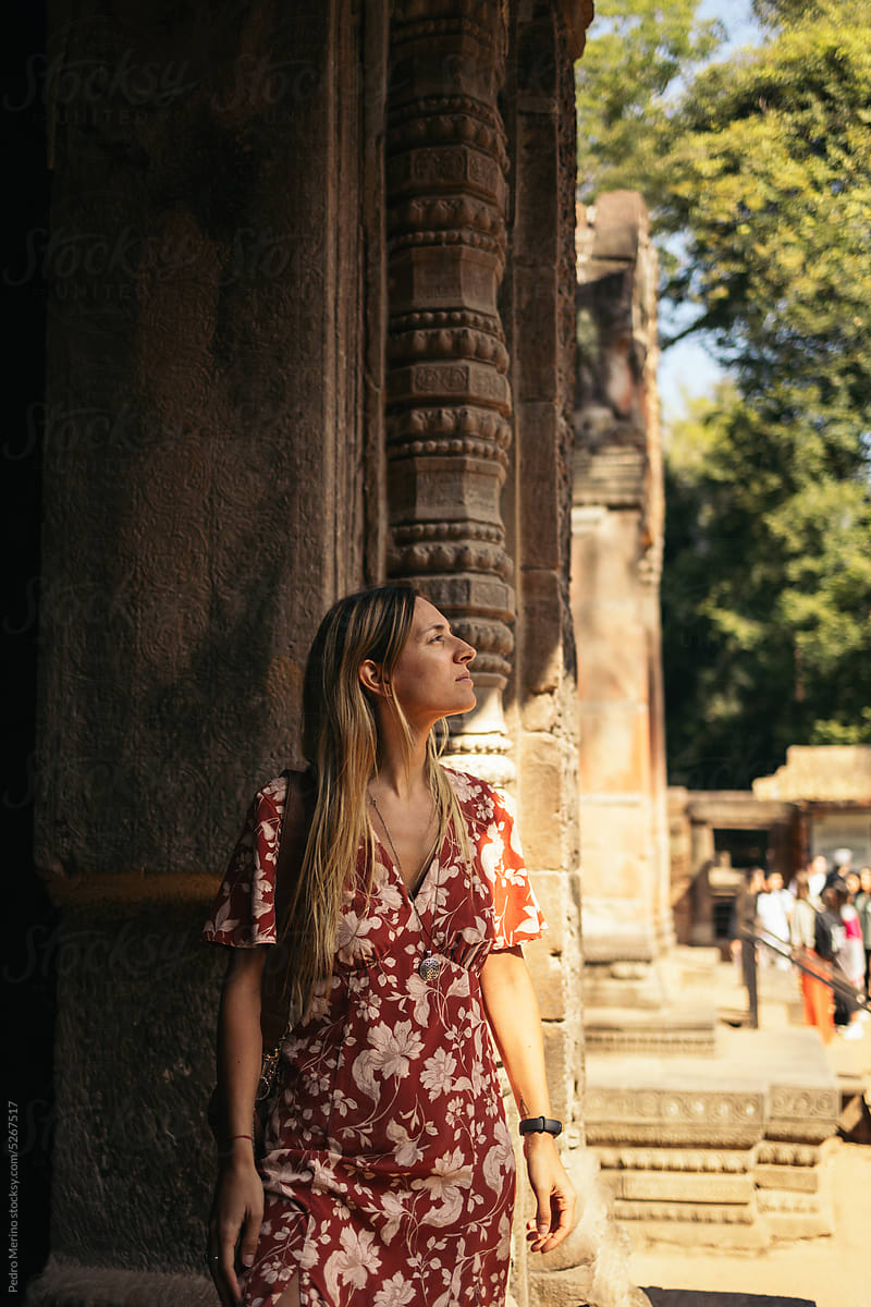 Tourist woman visiting Angkor temples