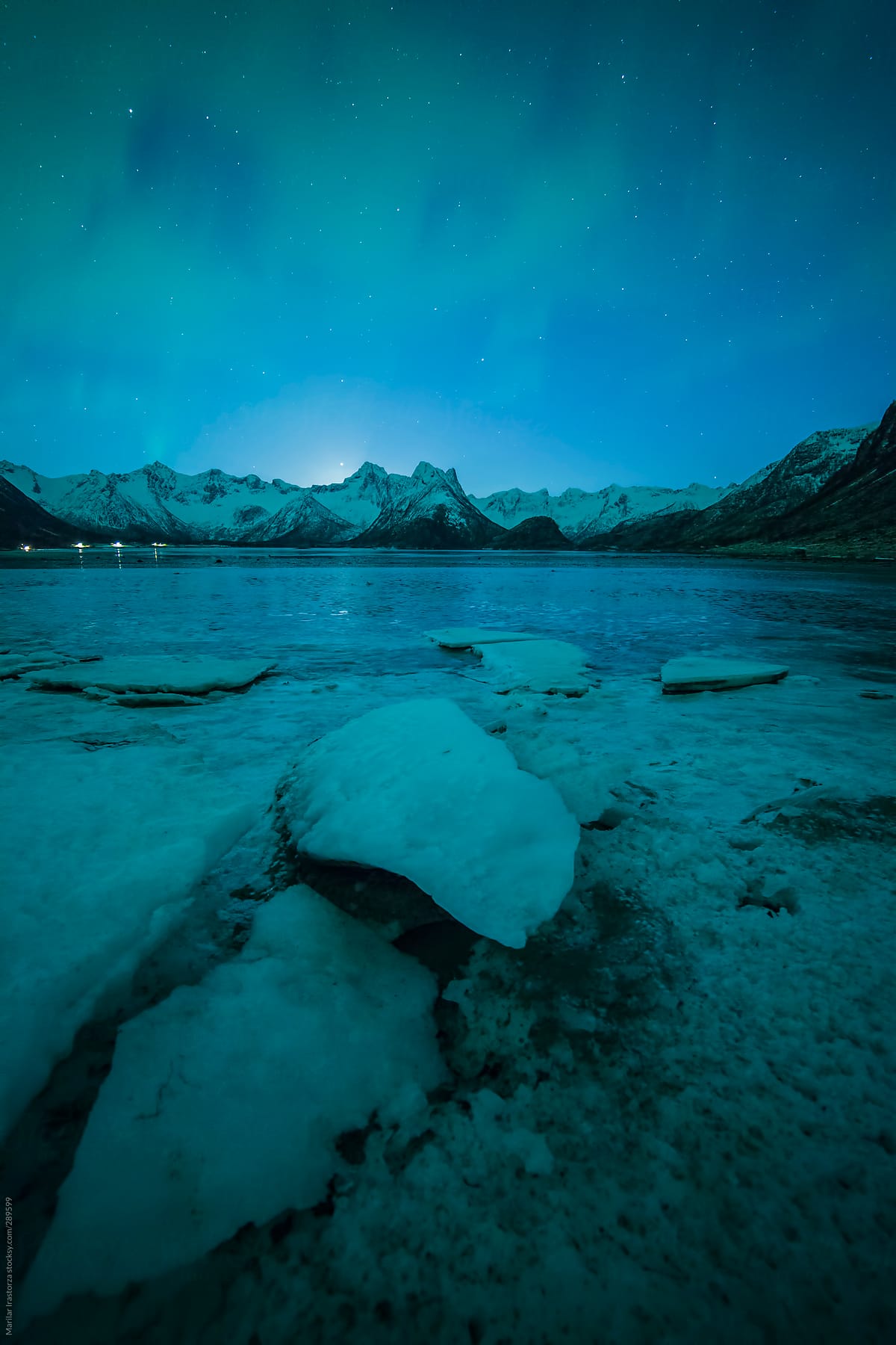 Northern lights over an ice lake