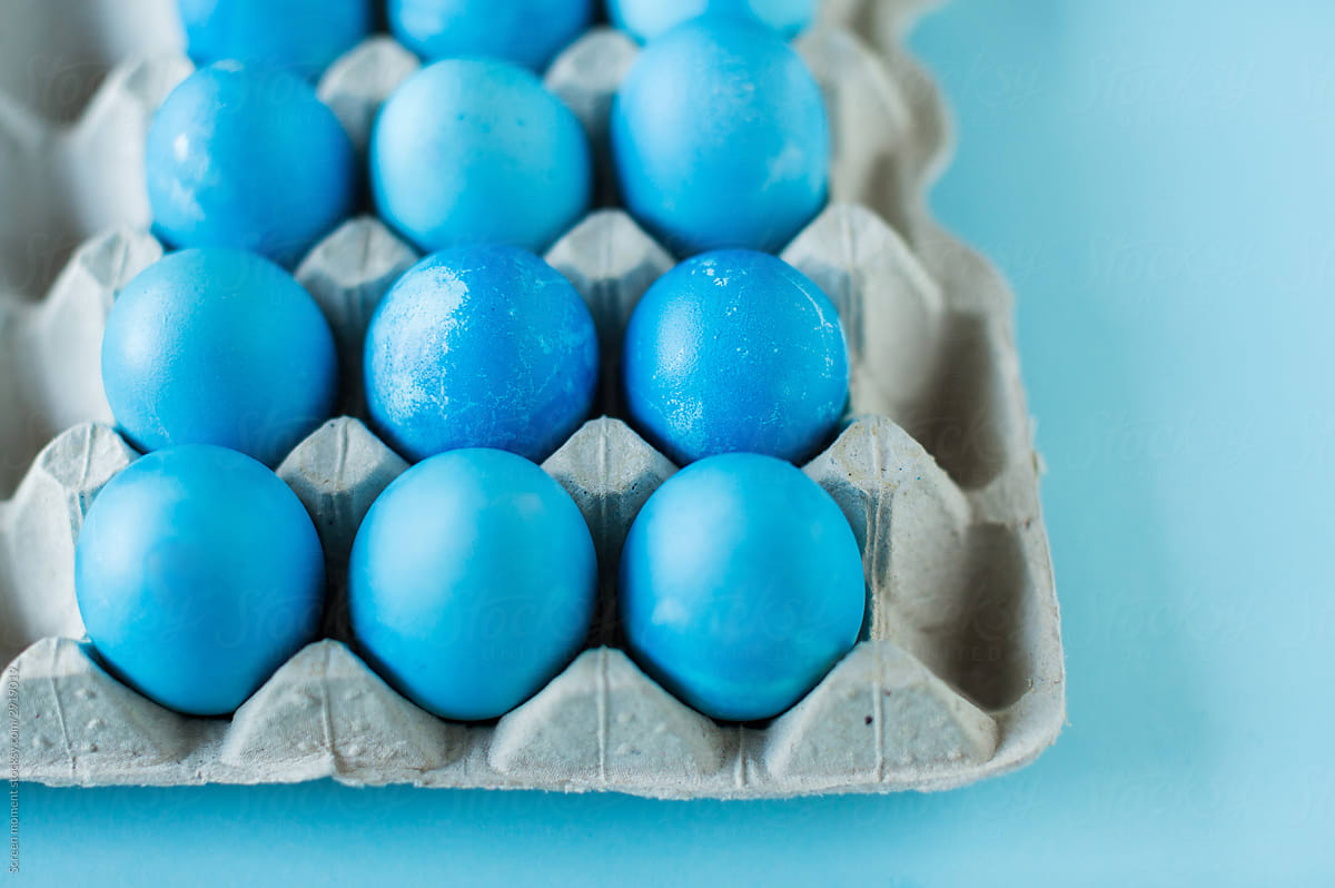 Blue Easter eggs  in the package  on blue background.