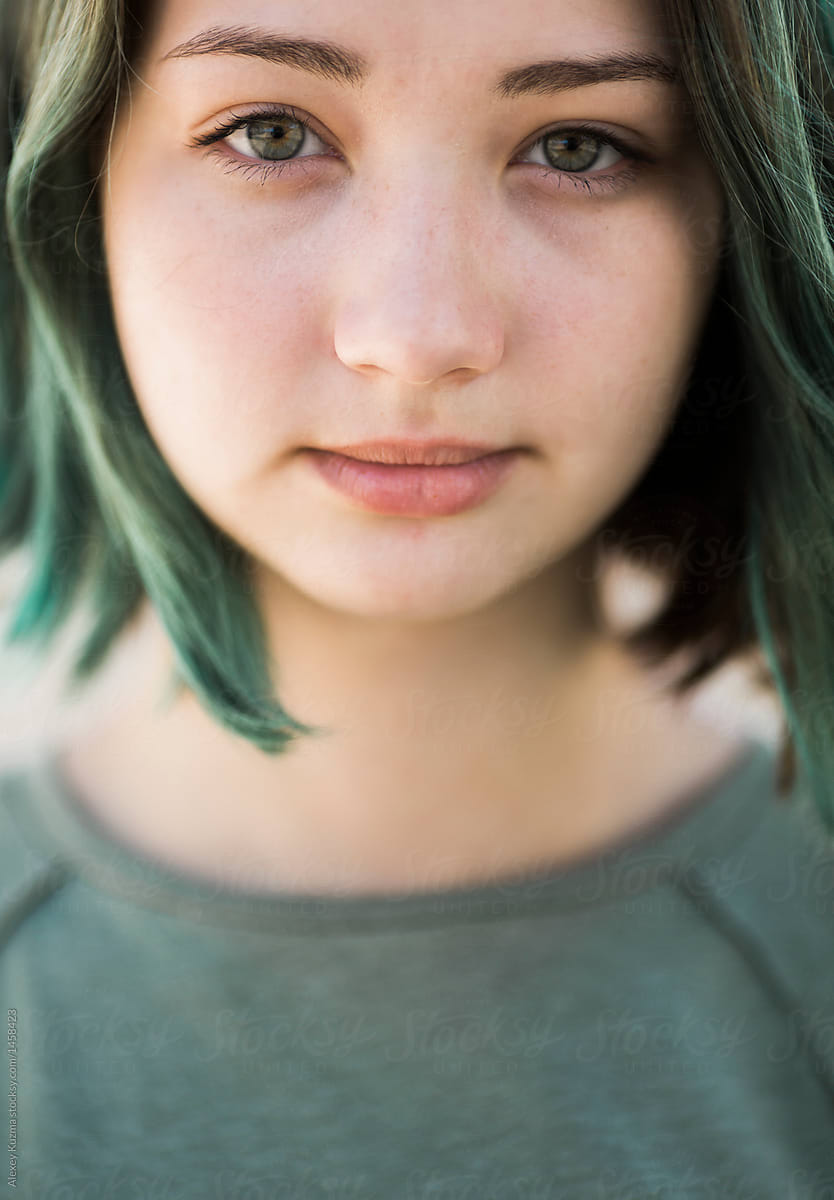 Close Up Of A Cute Teen Girl With Green Hair | Stocksy United