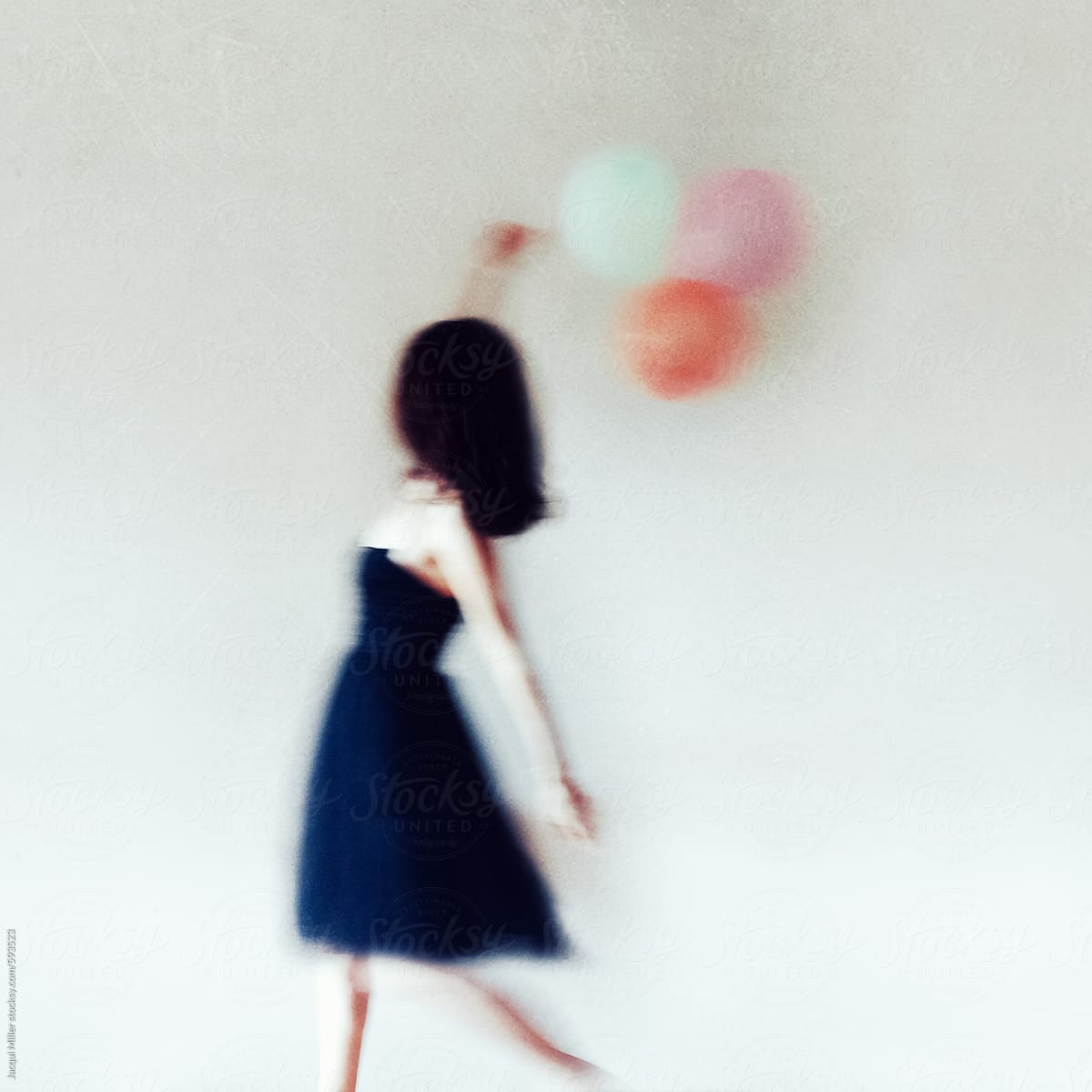Textured Movement Image Of Happy Woman With Balloons Del Colaborador De Stocksy Jacqui Miller 