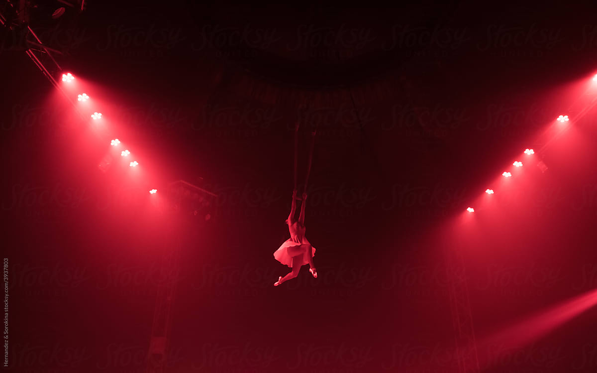 Impressive Performance Of Flying Gymnast In Lights