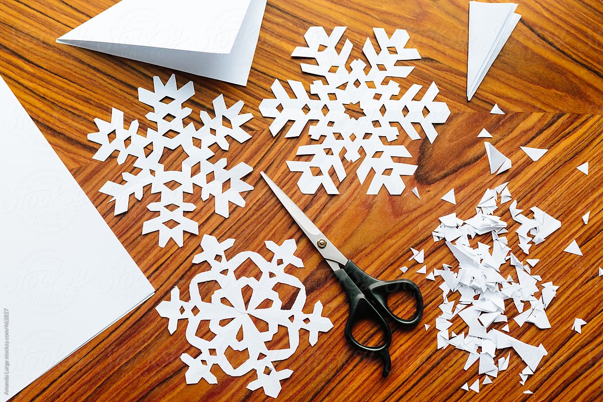 Making paper snowflake crafts.