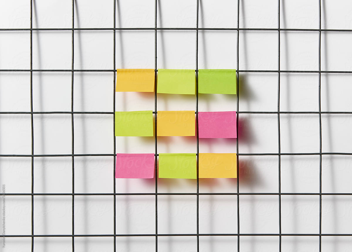Grid with paper stickers in office