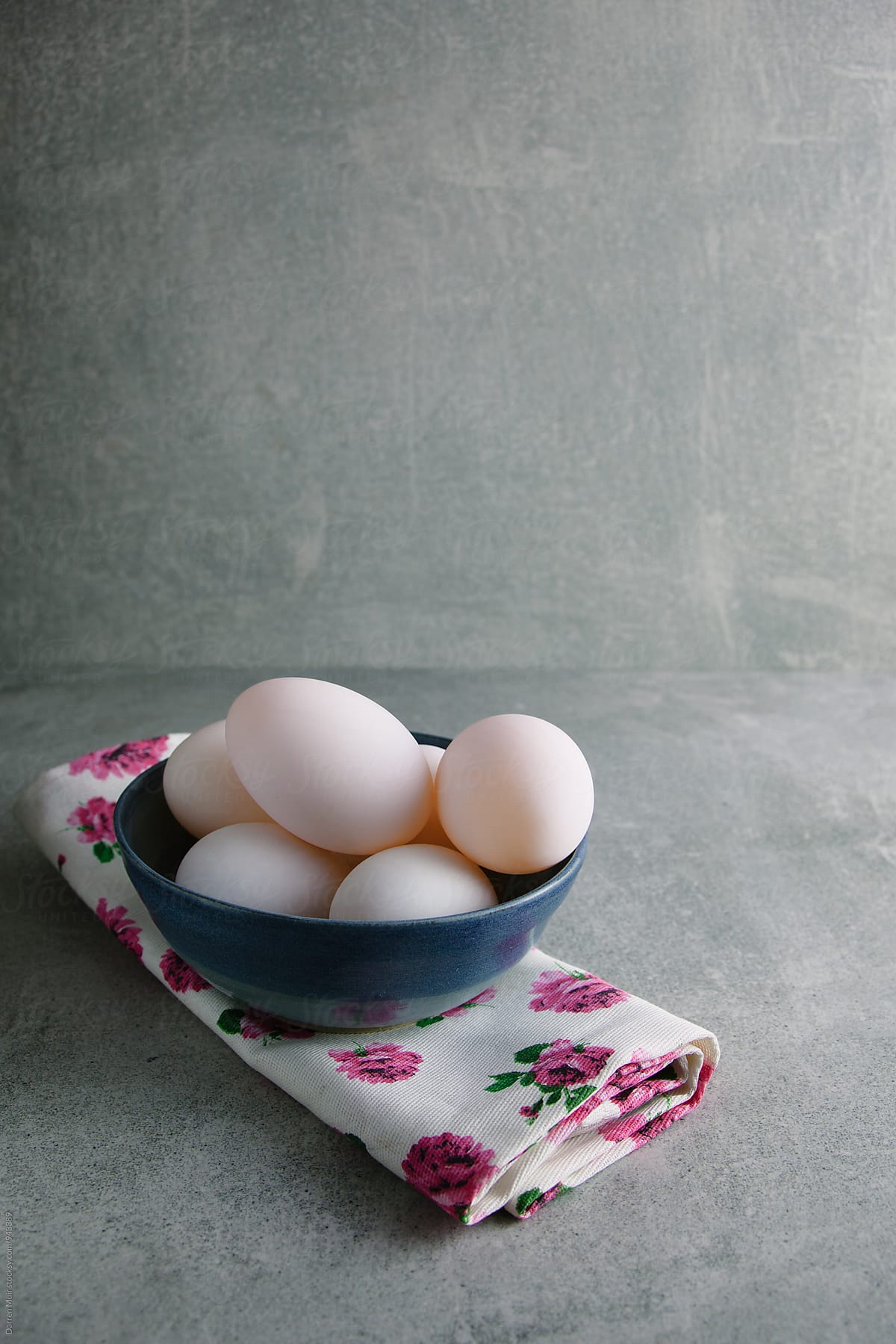 Duck eggs in a blue bowl.