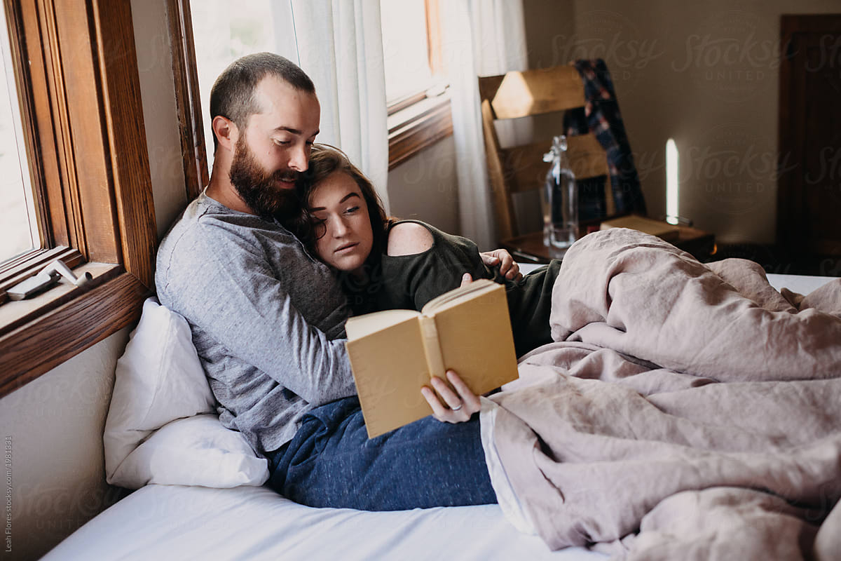 Couple Reading Together In Bed By Stocksy Contributor Leah Flores Stocksy 1255