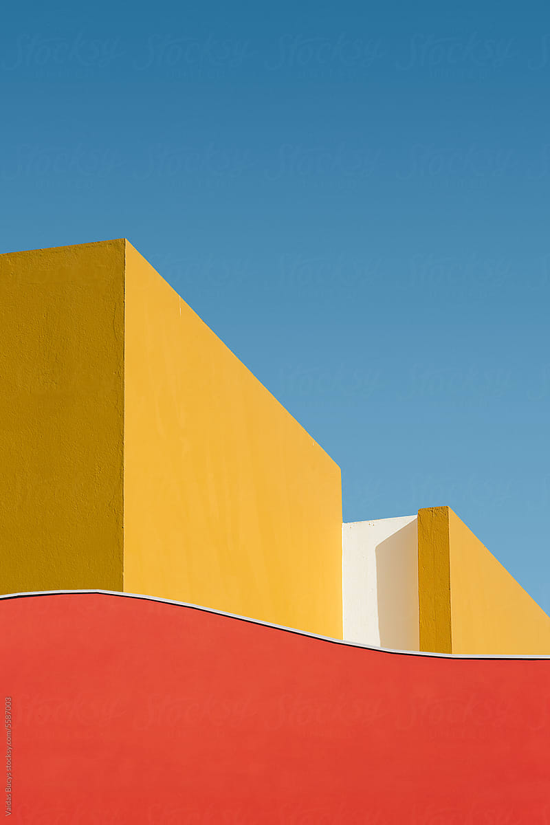 Geometric shape of colorful buildings against blue sky