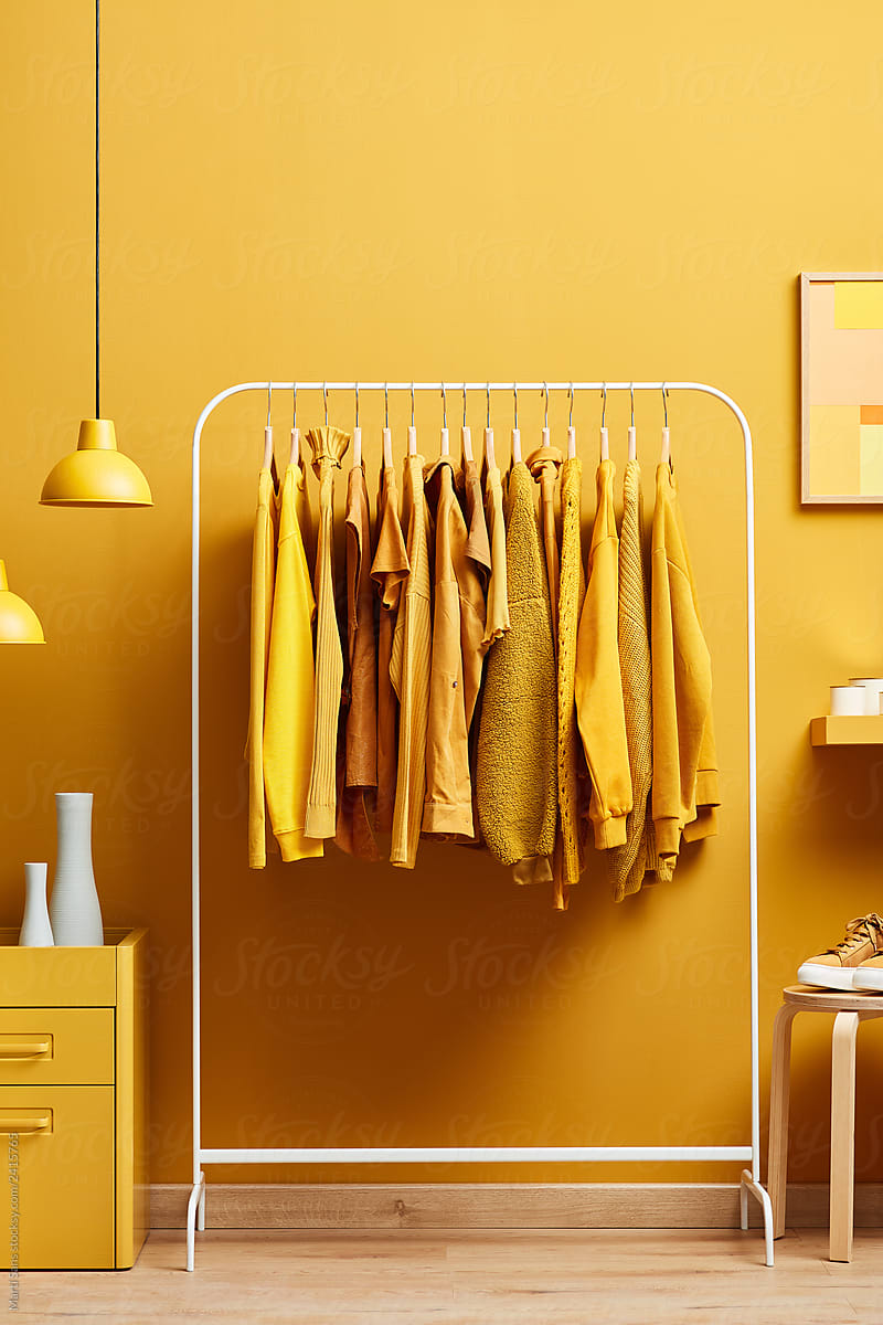 Creative clothes on rack in bright room