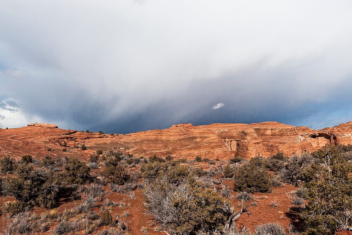 Approaching storm clouds over red rocks in Utah