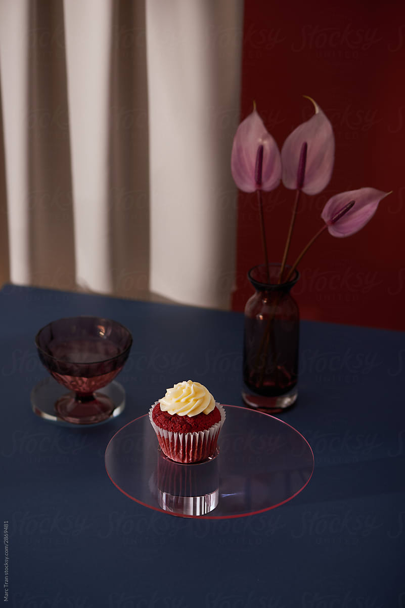 Velvet cake and crystal vase with bud of gardenia