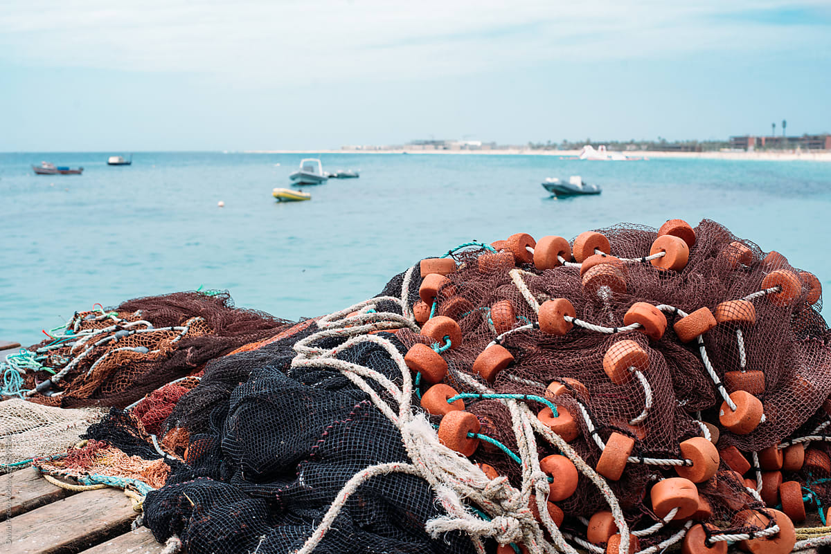 Fishing Net Drying On Pier Near Sea by Stocksy Contributor David Prado -  Stocksy
